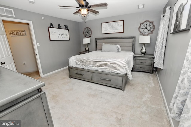 carpeted bedroom featuring baseboards and ceiling fan