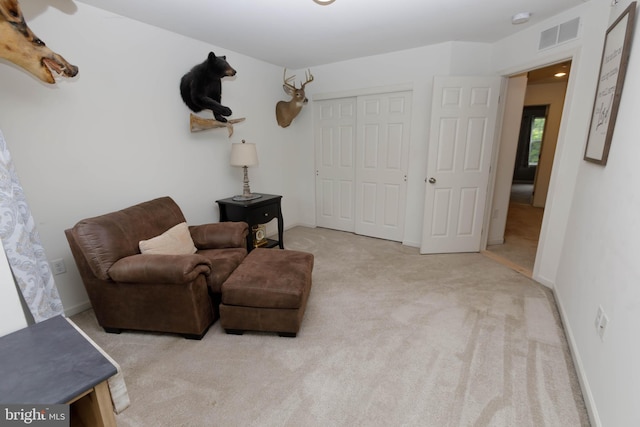 living area with carpet