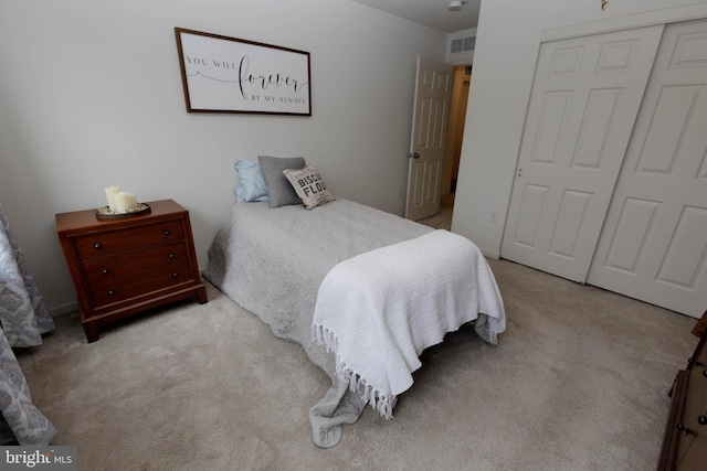 bedroom featuring a closet and carpet flooring