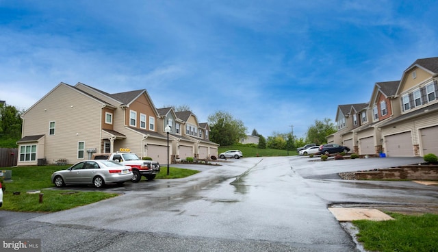 view of asphalt road featuring a residential view