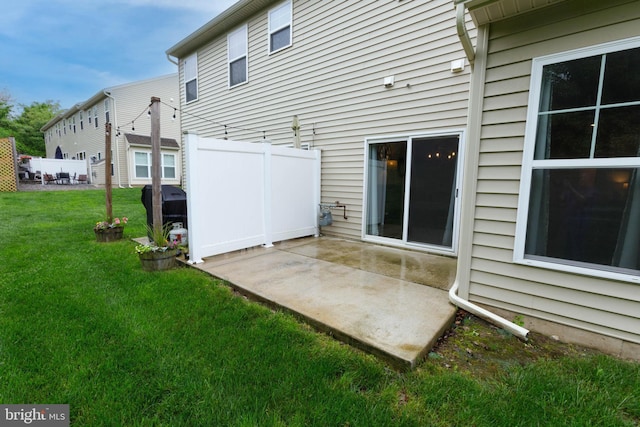 back of house with a patio