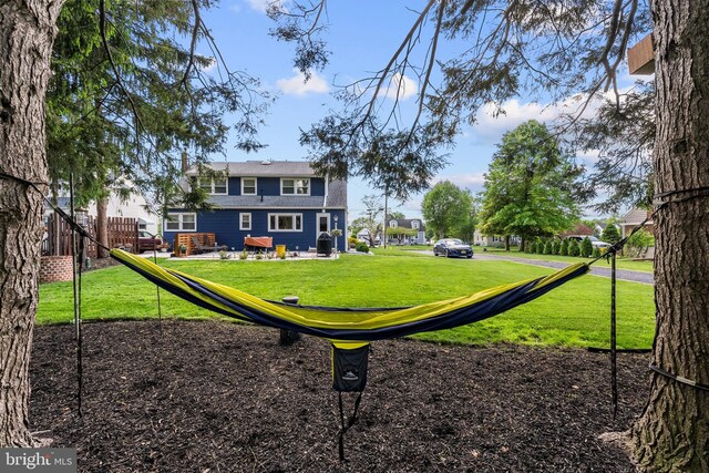 view of property's community with a lawn
