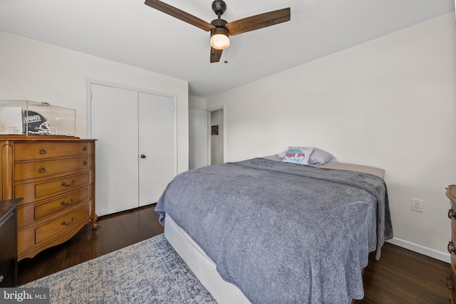 bedroom with wood finished floors, a closet, and a ceiling fan