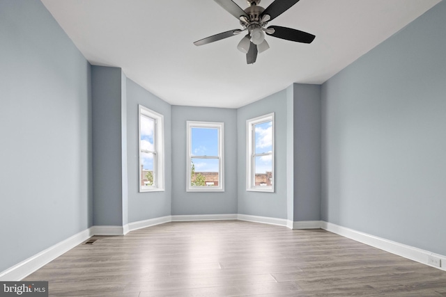 524 N Loudon Ave, Baltimore, MD 21229 - spare room featuring baseboards, wood finished floors, and a ceiling fan