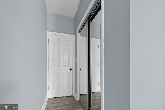 524 N Loudon Ave, Baltimore, MD 21229 - corridor featuring dark wood finished floors and baseboards