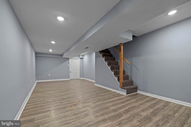 524 N Loudon Ave, Baltimore, MD 21229 - finished below grade area with baseboards, stairway, recessed lighting, and wood finished floors