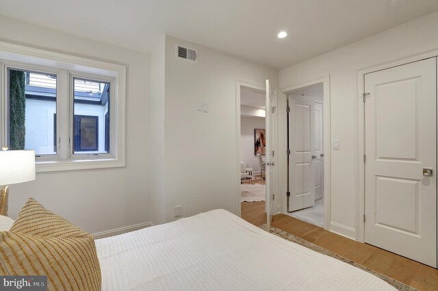 1335 11th St NW Unit 2, Washington, DC 20001 - bedroom with baseboards, light wood-type flooring, visible vents, and recessed lighting
