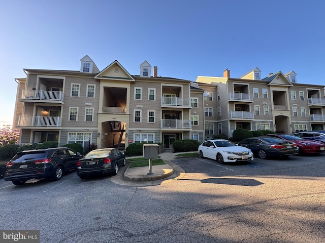 1037 Gardenview Loop Unit 304, Woodbridge, VA 22191 - view of apartment building / complex featuring uncovered parking