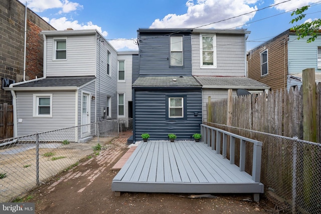 3602 5th St, Baltimore, MD 21225 - rear view of property featuring a fenced backyard and a deck