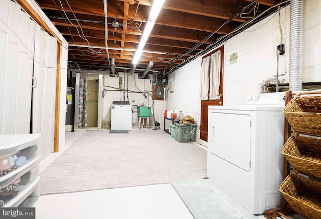 unfinished below grade area featuring washer / dryer