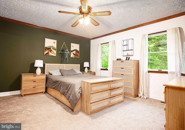 bedroom with light carpet, crown molding, a textured ceiling, baseboards, and ceiling fan
