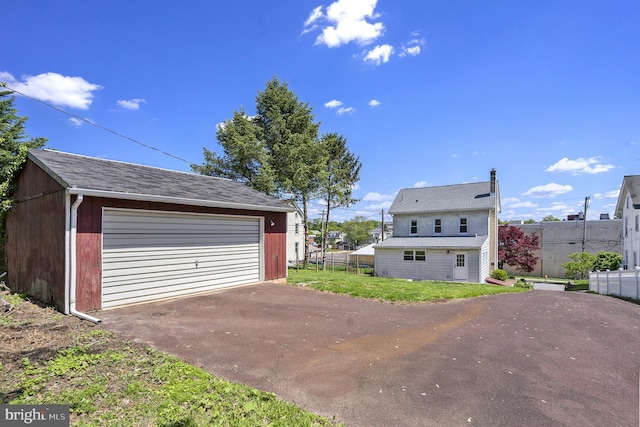 detached garage with fence