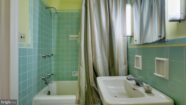 203 E Ferry Rd, Yardley, PA 19067 - bathroom featuring tile walls, a sink, and shower / bathtub combination with curtain