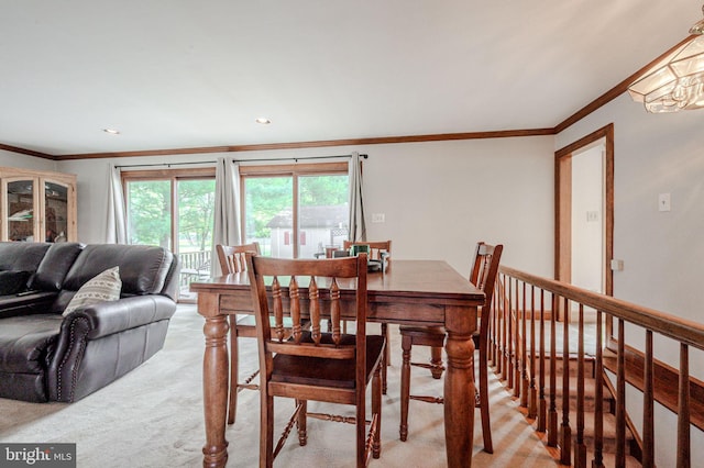 1140 Governor Lea Rd, Bear, DE 19701 - dining space featuring light carpet, ornamental molding, and a healthy amount of sunlight