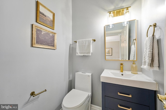bathroom featuring vanity and toilet