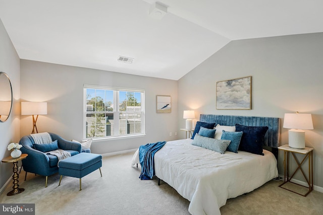 bedroom with carpet flooring, visible vents, baseboards, and vaulted ceiling