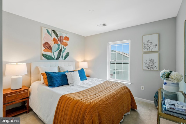 bedroom featuring baseboards, visible vents, and carpet floors