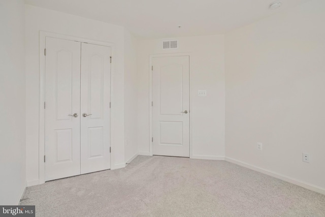 1646 Aster Ln, Hanover, MD 21076 - unfurnished bedroom featuring light carpet, baseboards, and a closet