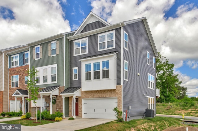 1646 Aster Ln, Hanover, MD 21076 - multi unit property with driveway, an attached garage, central AC unit, and a standing seam roof
