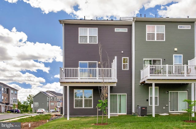 1646 Aster Ln, Hanover, MD 21076 - back of property featuring central AC unit, a lawn, and a residential view