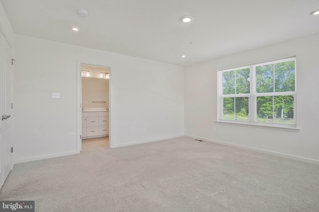 1646 Aster Ln, Hanover, MD 21076 - unfurnished bedroom with baseboards, light colored carpet, recessed lighting, and ensuite bath