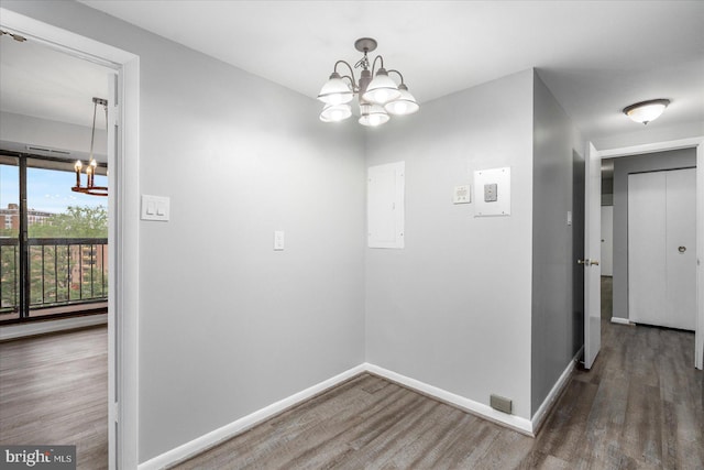 6317 Park Heights Ave Unit 616, Baltimore, MD 21215 - interior space featuring baseboards, a chandelier, electric panel, and wood finished floors