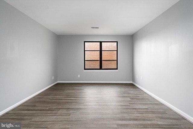 6317 Park Heights Ave Unit 616, Baltimore, MD 21215 - unfurnished room featuring baseboards, visible vents, and wood finished floors