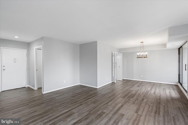6317 Park Heights Ave Unit 616, Baltimore, MD 21215 - unfurnished living room featuring baseboards, an inviting chandelier, recessed lighting, and dark wood-style floors