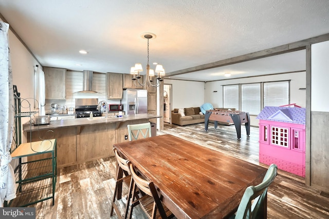 3900 Craig Ave, Dover, PA 17315 - dining area featuring wood finished floors, a chandelier, and a textured ceiling