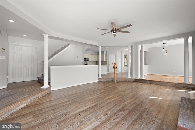 10288 Broken Sound Blvd, Ocean City, MD 21842 - unfurnished living room with ornate columns, a ceiling fan, wood finished floors, recessed lighting, and baseboards