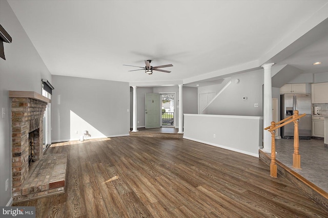 10288 Broken Sound Blvd, Ocean City, MD 21842 - unfurnished living room featuring a ceiling fan, wood finished floors, a fireplace, and baseboards