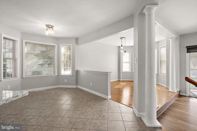 10288 Broken Sound Blvd, Ocean City, MD 21842 - unfurnished dining area with decorative columns and baseboards