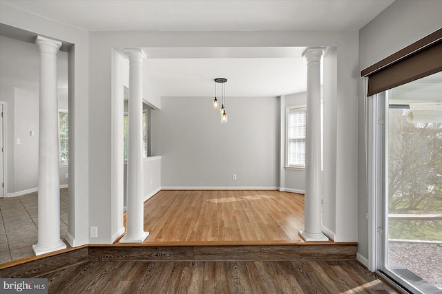 10288 Broken Sound Blvd, Ocean City, MD 21842 - interior space featuring wood finished floors, decorative columns, and baseboards