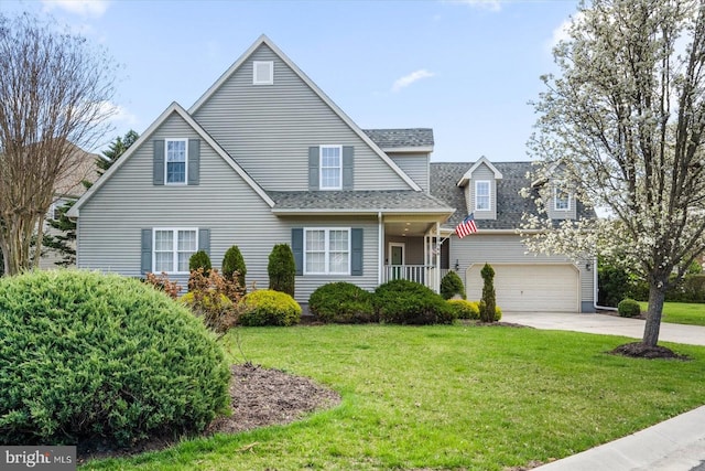 10288 Broken Sound Blvd, Ocean City, MD 21842 - view of front of property with roof with shingles, concrete driveway, a front yard, and a garage