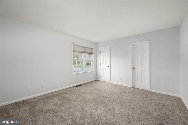 10288 Broken Sound Blvd, Ocean City, MD 21842 - carpeted spare room with baseboards