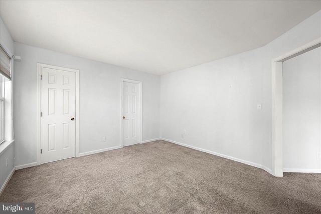 10288 Broken Sound Blvd, Ocean City, MD 21842 - carpeted empty room with baseboards