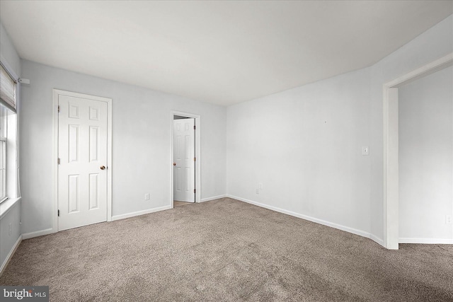 10288 Broken Sound Blvd, Ocean City, MD 21842 - carpeted spare room featuring baseboards and plenty of natural light