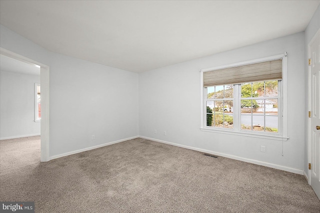 10288 Broken Sound Blvd, Ocean City, MD 21842 - carpeted empty room featuring baseboards