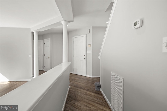 10288 Broken Sound Blvd, Ocean City, MD 21842 - hallway with dark wood-type flooring, ornate columns, and baseboards