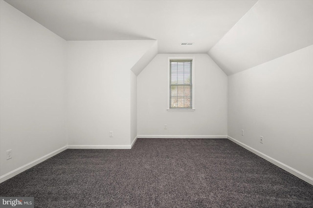 10288 Broken Sound Blvd, Ocean City, MD 21842 - additional living space with lofted ceiling, dark colored carpet, and baseboards