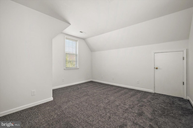 10288 Broken Sound Blvd, Ocean City, MD 21842 - additional living space with lofted ceiling, dark carpet, and baseboards