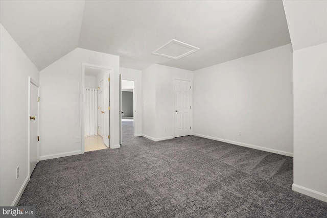 10288 Broken Sound Blvd, Ocean City, MD 21842 - unfurnished bedroom featuring attic access, carpet, baseboards, ensuite bath, and lofted ceiling