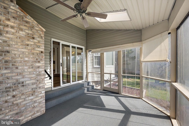 10288 Broken Sound Blvd, Ocean City, MD 21842 - unfurnished sunroom with lofted ceiling, a skylight, a ceiling fan, and plenty of natural light