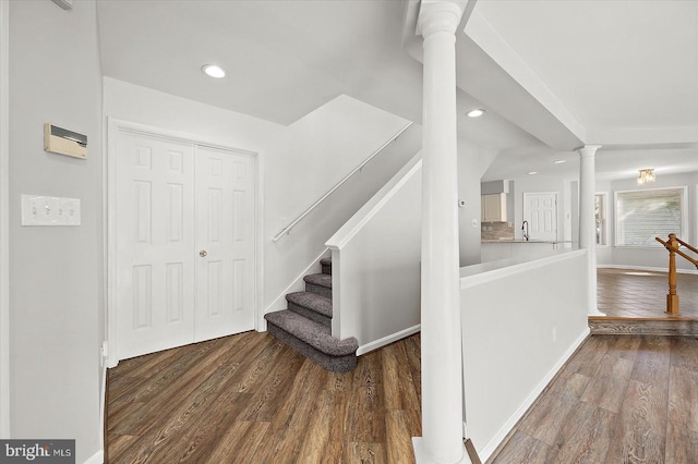 10288 Broken Sound Blvd, Ocean City, MD 21842 - stairway featuring wood finished floors, recessed lighting, decorative columns, and baseboards