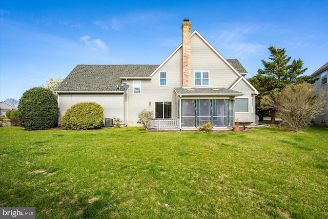 10288 Broken Sound Blvd, Ocean City, MD 21842 - back of house with a chimney, a lawn, a sunroom, and cooling unit