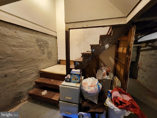 unfinished basement with stairway