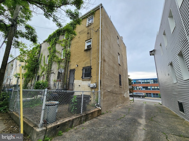 view of building exterior featuring fence