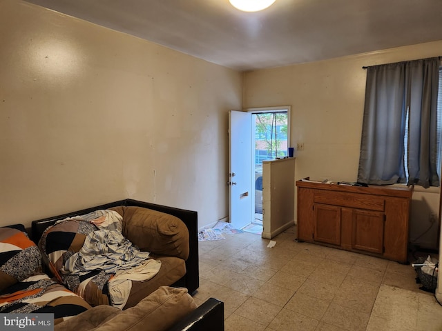 bedroom featuring light floors