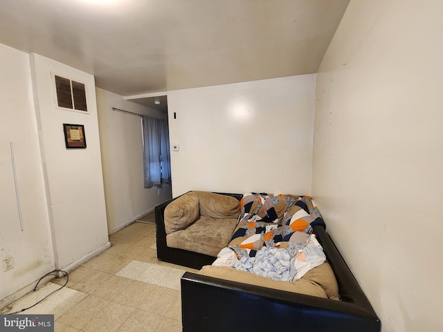 living room featuring light floors and visible vents
