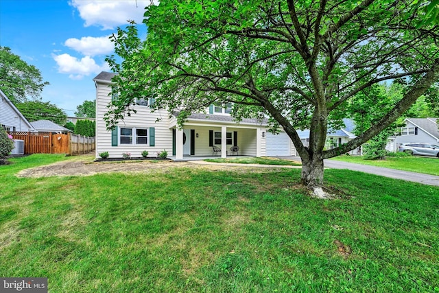 obstructed view of property featuring a porch, an attached garage, and driveway